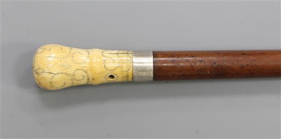 An early 19th century silver piqué and ivory handled malacca cane, 36.5in.